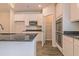 Modern kitchen featuring white cabinets, stainless steel appliances, and a pantry at 1613 Fuma Leaf Way, Mcdonough, GA 30253