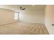 Spacious main bedroom with ceiling fan, carpet flooring, and natural light at 1613 Fuma Leaf Way, Mcdonough, GA 30253