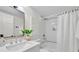 Well-lit bathroom with a modern shower, vanity, and sink at 3512 Hidden Acres Drive, Atlanta, GA 30340
