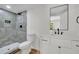 Bathroom featuring a walk-in shower, modern vanity, and black hardware at 3512 Hidden Acres Drive, Atlanta, GA 30340