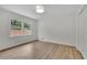 Clean bedroom with hardwood floors and a large window at 3512 Hidden Acres Drive, Atlanta, GA 30340