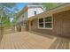 Back view showing deck overlooking backyard, with brick exterior at 3512 Hidden Acres Drive, Atlanta, GA 30340