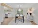 Dining room with an open layout, stylish decor, and hardwood floors at 3512 Hidden Acres Drive, Atlanta, GA 30340