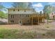 Rear exterior home view with brick exterior, walk out basement, and wooden deck at 3512 Hidden Acres Drive, Atlanta, GA 30340