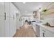 Modern kitchen with stainless steel appliances, white cabinetry, and wood floors at 3512 Hidden Acres Drive, Atlanta, GA 30340