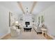 Bright living room with vaulted ceiling, wooden beams, and a cozy fireplace at 3512 Hidden Acres Drive, Atlanta, GA 30340