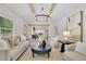 Bright living room featuring hardwood floors, modern lighting fixture, and neutral color scheme at 3512 Hidden Acres Drive, Atlanta, GA 30340