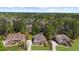 A high angle shot reveals multiple homes nestled among lush greenery in a well-planned community at 6252 Fernstone Trl, Acworth, GA 30101