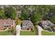 Stunning aerial view of a well-maintained brick home with a lush green lawn at 6252 Fernstone Trl, Acworth, GA 30101