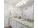 Spacious bathroom with double sinks, a granite countertop, and white cabinets at 6252 Fernstone Trl, Acworth, GA 30101