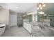 Bright bathroom with granite countertop, double sinks, glass shower, and freestanding bathtub at 6252 Fernstone Trl, Acworth, GA 30101