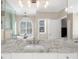 Bright bathroom featuring a granite countertop, vanity, and a window with modern shutters at 6252 Fernstone Trl, Acworth, GA 30101