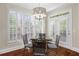Bright dining area featuring natural light and hardwood flooring at 6252 Fernstone Trl, Acworth, GA 30101