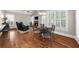 Cozy dining area with hardwood floors, plantation shutters, and modern lighting fixture at 6252 Fernstone Trl, Acworth, GA 30101