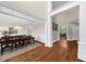 Elegant dining room with hardwood floors and chandelier with open entry to hall at 6252 Fernstone Trl, Acworth, GA 30101