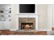 Close-up of stone fireplace with white mantle and built-in shelving on either side at 6252 Fernstone Trl, Acworth, GA 30101