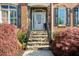 Stone steps lead to the front door of this red brick home at 6252 Fernstone Trl, Acworth, GA 30101