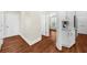 Hallway that has white cabinets visible, with hardwood floors at 6252 Fernstone Trl, Acworth, GA 30101