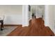 Inviting hallway featuring gleaming hardwood floors and elegant trim at 6252 Fernstone Trl, Acworth, GA 30101