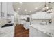 Spacious kitchen with white cabinets, granite countertops, and hardwood floors at 6252 Fernstone Trl, Acworth, GA 30101