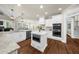 Open kitchen boasts stainless steel appliances and granite countertops at 6252 Fernstone Trl, Acworth, GA 30101