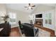 Casual living area with plantation shutters and a stone fireplace at 6252 Fernstone Trl, Acworth, GA 30101