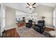 Open living space with casual seating, hardwood floors, and view into kitchen at 6252 Fernstone Trl, Acworth, GA 30101