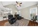 Living area with open floor plan and view of modern kitchen at 6252 Fernstone Trl, Acworth, GA 30101