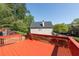 Inviting back deck area offers space for relaxation, featuring mature trees providing shade at 2361 Maplewood Ct # 25, Atlanta, GA 30339