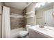 Bathroom with shower and tub, floating shelves, and vanity with sink at 2361 Maplewood Ct # 25, Atlanta, GA 30339