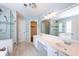 Bright bathroom with double sink vanity, tiled floors, walk in shower, and a separate bathtub at 2361 Maplewood Ct # 25, Atlanta, GA 30339