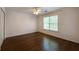 Bedroom with hardwood floors, ceiling fan, closet and window providing natural light at 2361 Maplewood Ct # 25, Atlanta, GA 30339