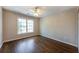 Carpeted bedroom with ceiling fan, large window, and double-door closet at 2361 Maplewood Ct # 25, Atlanta, GA 30339