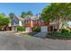 Street view of townhomes showing varied architectural styles, driveways, and manicured landscaping at 2361 Maplewood Ct # 25, Atlanta, GA 30339