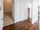 Hallway with hardwood floors, white walls, and staircase at 2361 Maplewood Ct # 25, Atlanta, GA 30339