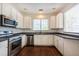 Kitchen with stainless steel appliances and tile backsplash at 2361 Maplewood Ct # 25, Atlanta, GA 30339
