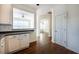 Open concept kitchen view showcasing hardwood floors and a seamless transition to other rooms at 2361 Maplewood Ct # 25, Atlanta, GA 30339