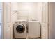 Laundry room featuring washer and dryer, wire shelving and tile floor at 2361 Maplewood Ct # 25, Atlanta, GA 30339