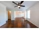 Spacious living room featuring hardwood floors, ceiling fan, and seamless flow to other areas at 2361 Maplewood Ct # 25, Atlanta, GA 30339