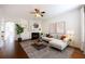 Cozy living room with fireplace, ceiling fan and large windows for natural light at 2361 Maplewood Ct # 25, Atlanta, GA 30339