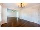 Bright living room featuring hardwood floors, modern light fixture and plenty of natural light at 2361 Maplewood Ct # 25, Atlanta, GA 30339
