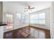 Bright living room with hardwood floors, a ceiling fan, and a door leading to outdoor space at 2361 Maplewood Ct # 25, Atlanta, GA 30339