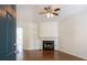 Comfortable living room with fireplace, built-in shelving, and hardwood floors at 2361 Maplewood Ct # 25, Atlanta, GA 30339