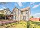 Backyard with a brick patio, covered porch, and ample green space at 2470 Suwanee Lakes Trl, Suwanee, GA 30024