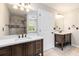 Bathroom featuring and sinks and vanity, and shower with glass door at 2470 Suwanee Lakes Trl, Suwanee, GA 30024
