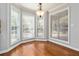 Bright dining area with hardwood floors, chair rail molding, and large windows with peaceful views at 2470 Suwanee Lakes Trl, Suwanee, GA 30024