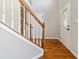 Bright entryway with hardwood floors, staircase, and decorative glass door, creating an inviting first impression at 2470 Suwanee Lakes Trl, Suwanee, GA 30024