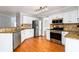 Beautiful kitchen with white cabinets, stainless steel appliances, and granite countertops at 2470 Suwanee Lakes Trl, Suwanee, GA 30024