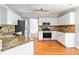 Bright kitchen with white cabinets, stainless steel appliances, and granite countertops at 2470 Suwanee Lakes Trl, Suwanee, GA 30024