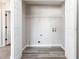 Open closet laundry area with washer and dryer hookups at 2470 Suwanee Lakes Trl, Suwanee, GA 30024